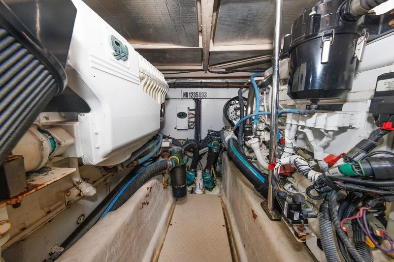Slide: The Image of Engine room of 2010 Sea Ray 520 Sedan Bridge, showcasing mechanical components and wiring. - 64