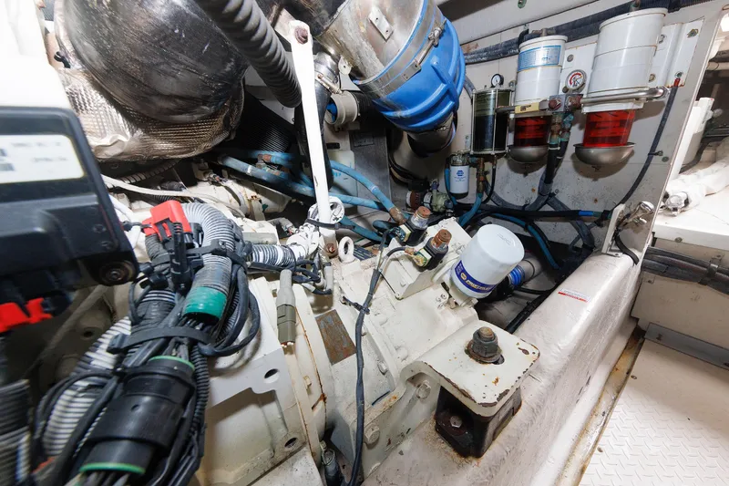 Slide: The Image of Engine room of 2010 Sea Ray 520 Sedan Bridge with visible components and wiring. - 68
