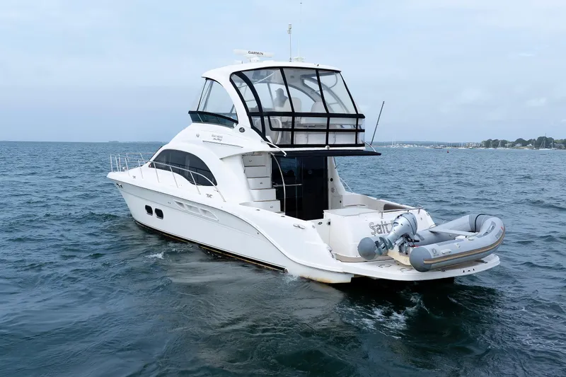 Slide: The Image of 2010 Sea Ray 520 Sedan Bridge yacht cruising on open water. - 9