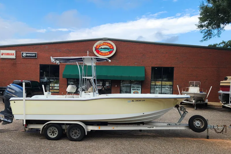 The Image of 2005 Polar 2310 Bay boat on trailer outside marine store. - 0