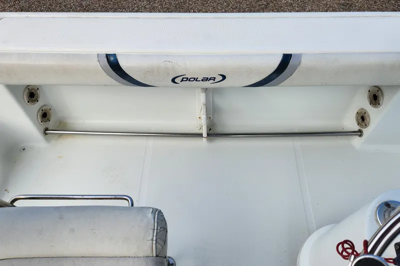 Slide: The Image of 2005 Polar 2310 Bay boat interior with seating and rod holder. - 10