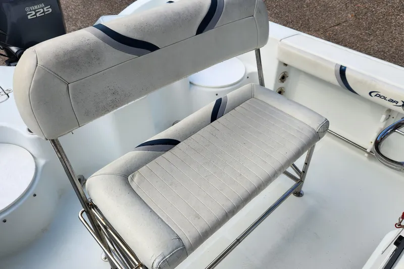 Slide: The Image of 2005 Polar 2310 Bay boat seating with Yamaha 225 engine in background. - 11