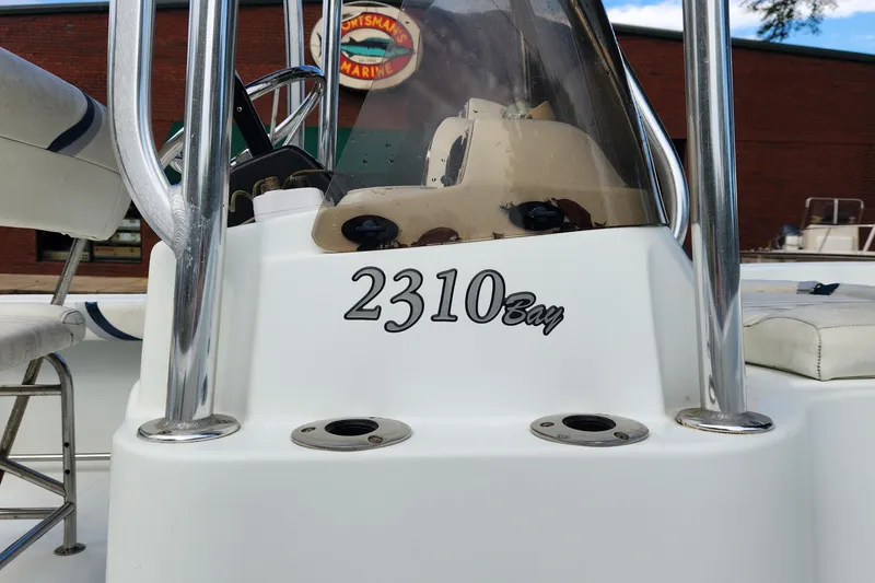 Slide: The Image of 2005 Polar 2310 Bay boat console with chrome details and seating. - 4