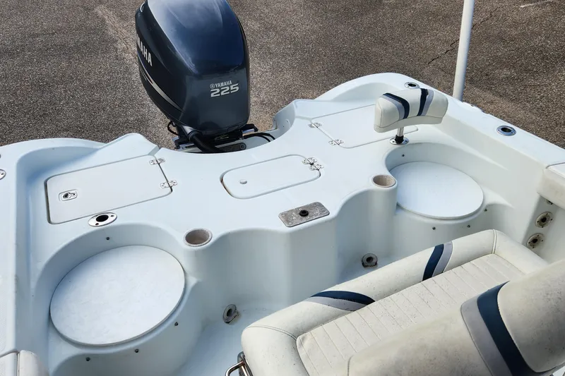 Slide: The Image of 2005 Polar 2310 Bay boat with Yamaha 225 engine, featuring seating and storage compartments. - 6