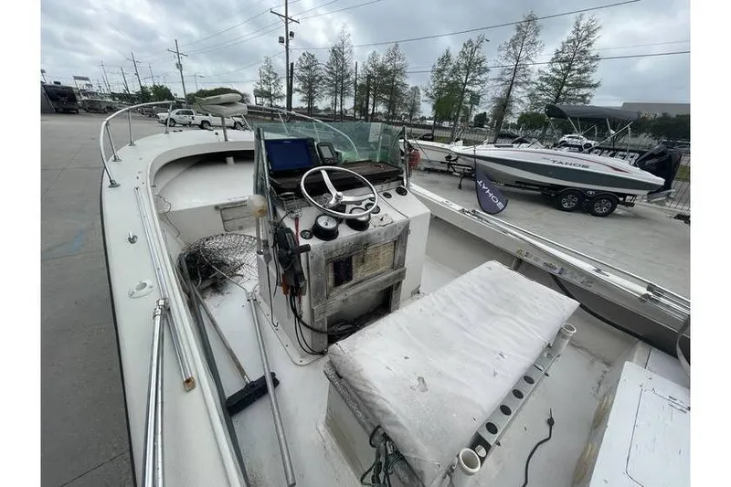 Slide: The Image of 1973 Wellcraft 200 Fisherman boat with Mercury 200 outboard motor, parked on trailer. - 3