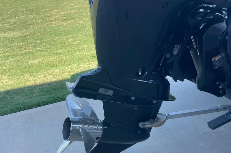 Slide: The Image of 2018 Ranger Z185 boat motor and propeller on concrete surface. - 11