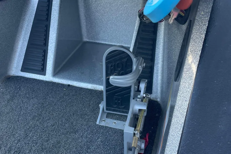 Slide: The Image of 2018 Ranger Z185 boat foot pedal with "Hot Foot" branding on carpeted floor. - 8