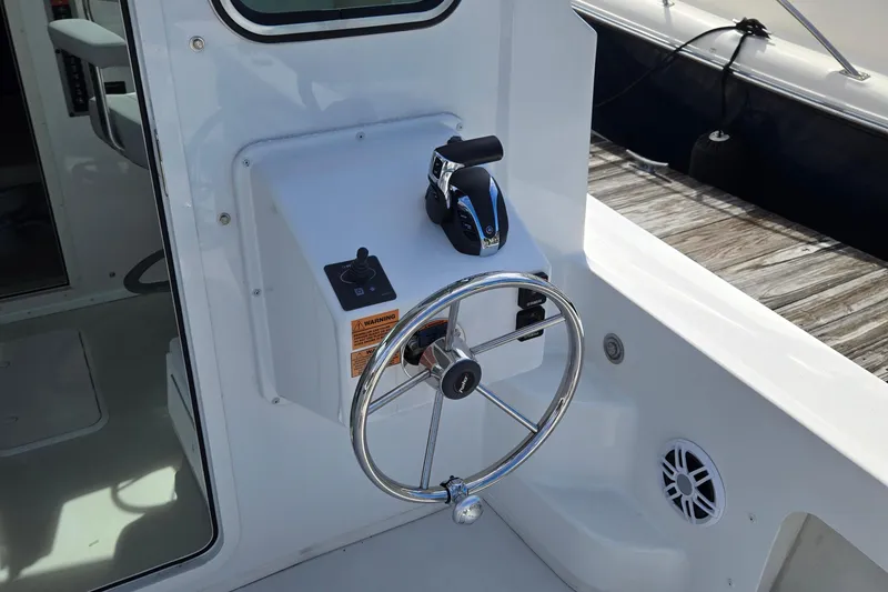 Slide: The Image of Steering wheel and controls of 2022 Parker 2520 XLD Sport Cabin boat. - 4