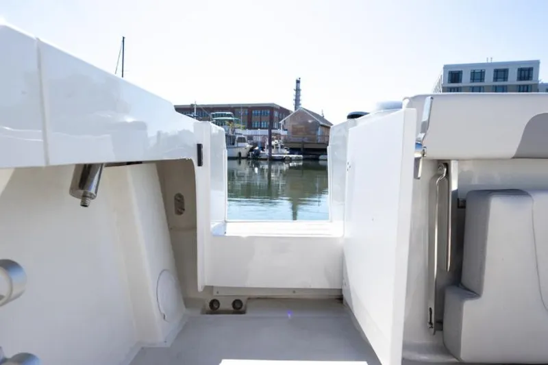 Slide: The Image of Manufacturer Provided Image: 2022 Parker 2520 XLD Sport Cabin boat interior with marina view. - 9