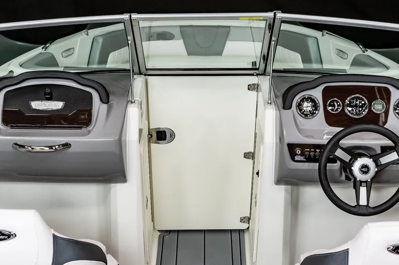 Slide: The Image of Manufacturer Provided Image: 2025 Chaparral 21 SSi boat interior, featuring sleek dashboard and steering wheel design. - 6
