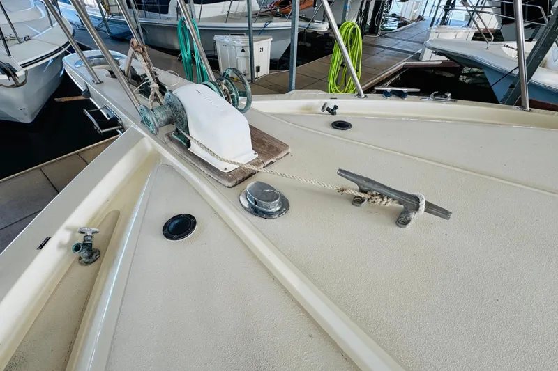 Slide: The Image of 1986 Californian 48 Motor Yacht deck with winch and cleat in marina. - 10
