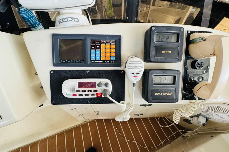 Slide: The Image of Control panel of a 1986 Californian 48 Motor Yacht with navigation and communication equipment. - 32