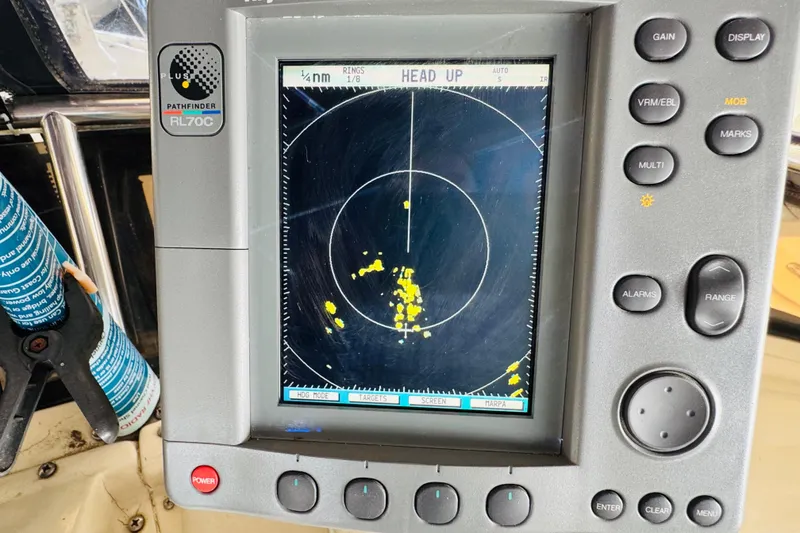 Slide: The Image of Radar display on 1986 Californian 48 Motor Yacht, showing navigation data and controls. - 33