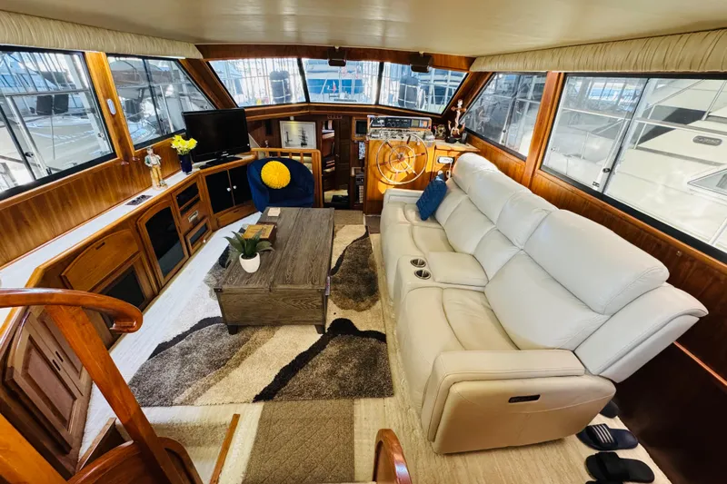 Slide: The Image of Luxurious interior of 1986 Californian 48 Motor Yacht with plush seating and elegant decor. - 35