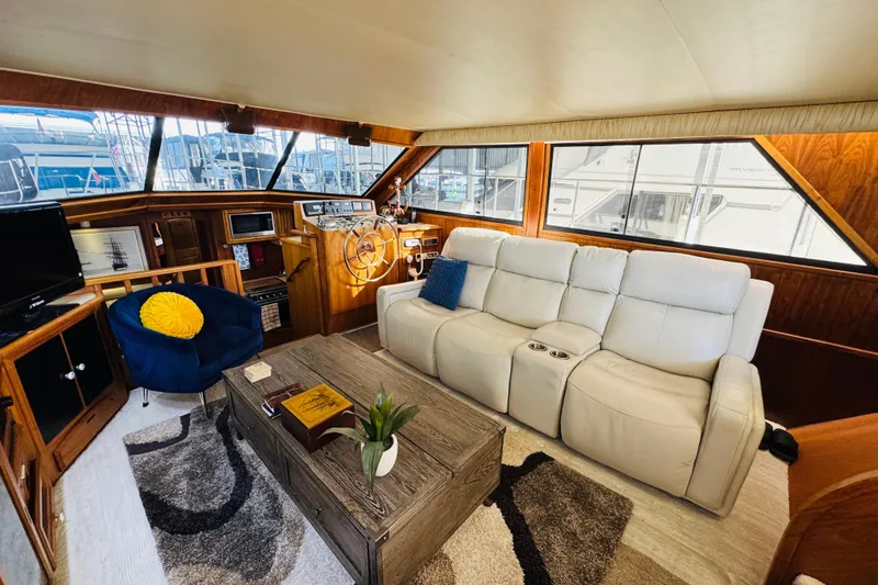 Slide: The Image of Luxurious interior of 1986 Californian 48 Motor Yacht with plush seating and elegant decor. - 38