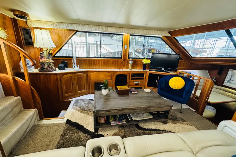 Slide: The Image of Luxurious interior of a 1986 Californian 48 Motor Yacht with cozy seating and elegant decor. - 40