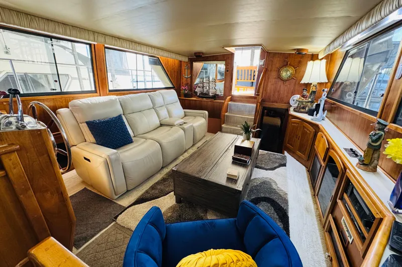 Slide: The Image of Luxurious interior of 1986 Californian 48 Motor Yacht with plush seating and elegant decor. - 42