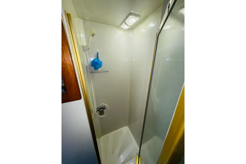 Slide: The Image of Shower area in 1986 Californian 48 Motor Yacht with glass door and shelf. - 59
