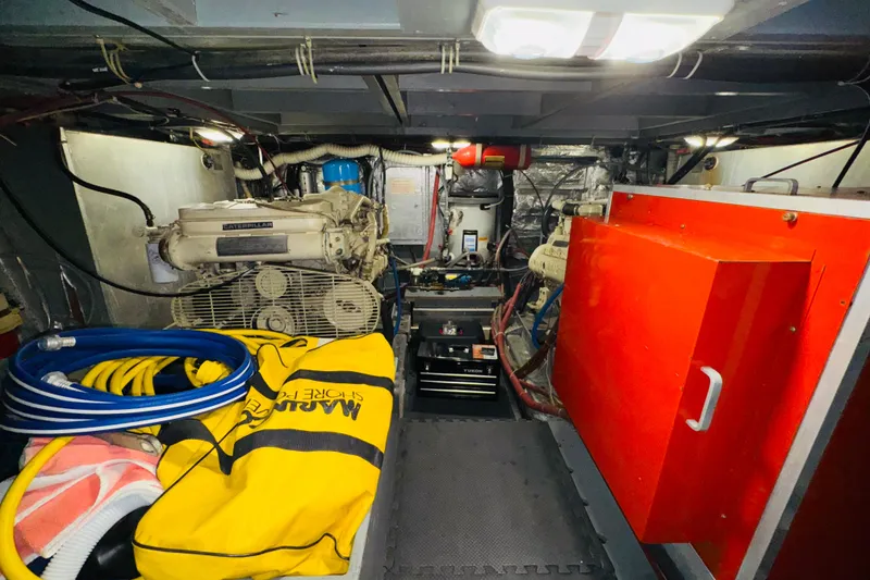 Slide: The Image of Engine room of 1986 Californian 48 Motor Yacht with equipment and storage. - 68