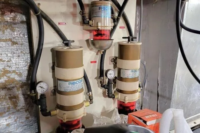 Slide: The Image of Engine room of 1986 Californian 48 Motor Yacht with Racor fuel filters. - 73