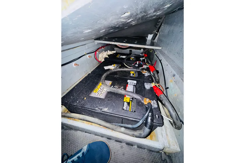 Slide: The Image of Battery compartment of 1986 Californian 48 Motor Yacht with cables and connections. - 75