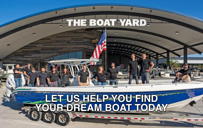 Slide: The Image of Group posing on 2007 Pro-Line 21 Walk boat at The Boat Yard dealership. - 11