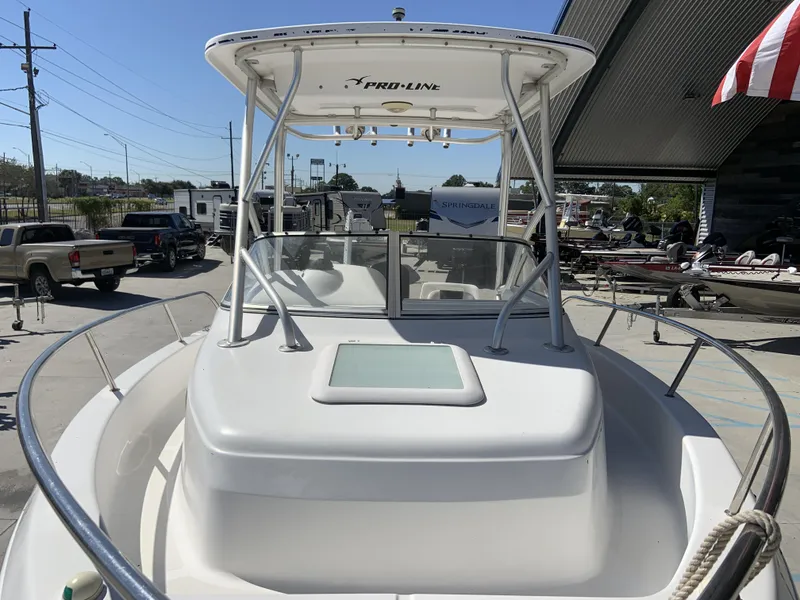 Slide: The Image of 2007 Pro-Line 21 Walk boat with T-top, docked in a marina. - 14