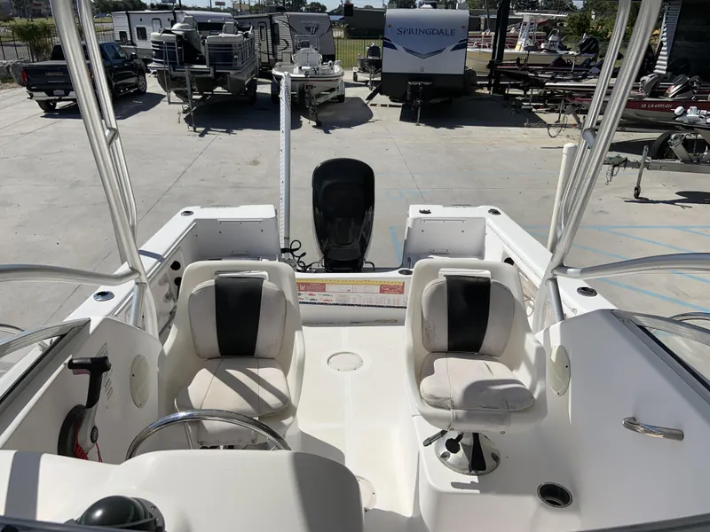 Slide: The Image of 2007 Pro-Line 21 Walk boat interior with dual seats and steering wheel. - 21