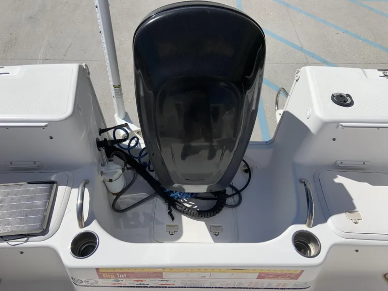 Slide: The Image of 2007 Pro-Line 21 Walk boat interior with engine and storage compartments. - 23