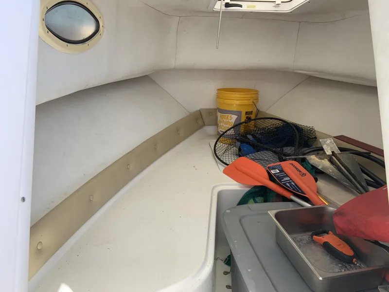 Slide: The Image of 2007 Pro-Line 21 Walk cabin interior with fishing gear and equipment. - 7