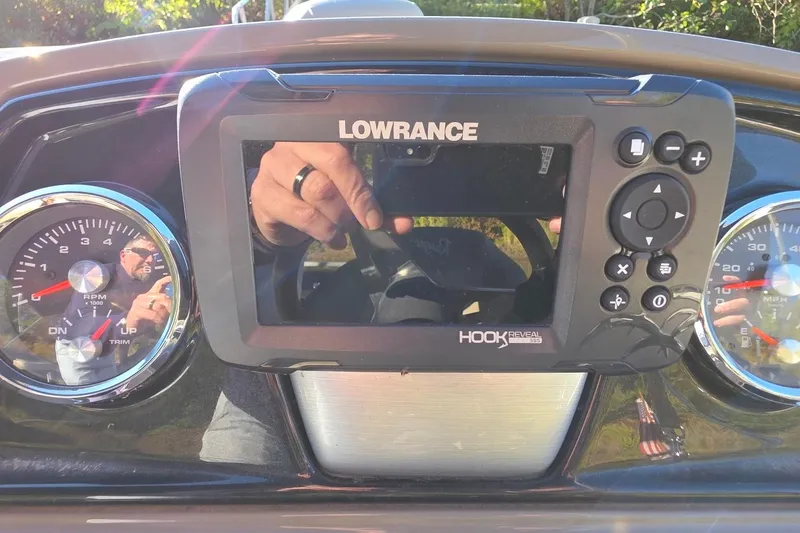Slide: The Image of Dashboard of 2023 Ranger Reata 200F with Lowrance Hook Reveal GPS and gauges. - 5