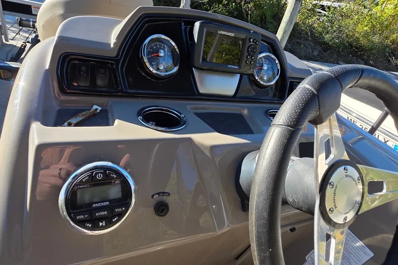 Slide: The Image of 2023 Ranger Reata 200F dashboard with steering wheel, gauges, and electronic display. - 6