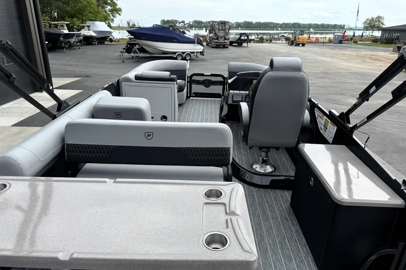 Slide: The Image of Interior of 2026 Premier 230 Solaris RS pontoon boat with modern seating and amenities. - 14
