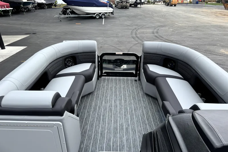 Slide: The Image of 2026 Premier 230 SOLARIS RS pontoon boat interior with luxurious seating and modern design. - 24