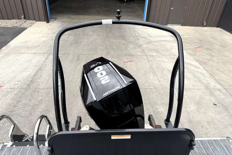 Slide: The Image of 2026 Premier 230 SOLARIS RS with Mercury outboard motor, viewed from the rear. - 31