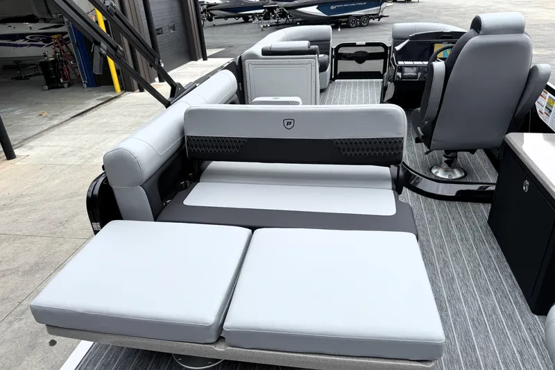 Slide: The Image of 2026 Premier 230 SOLARIS RS pontoon boat interior with gray seating and modern design. - 33