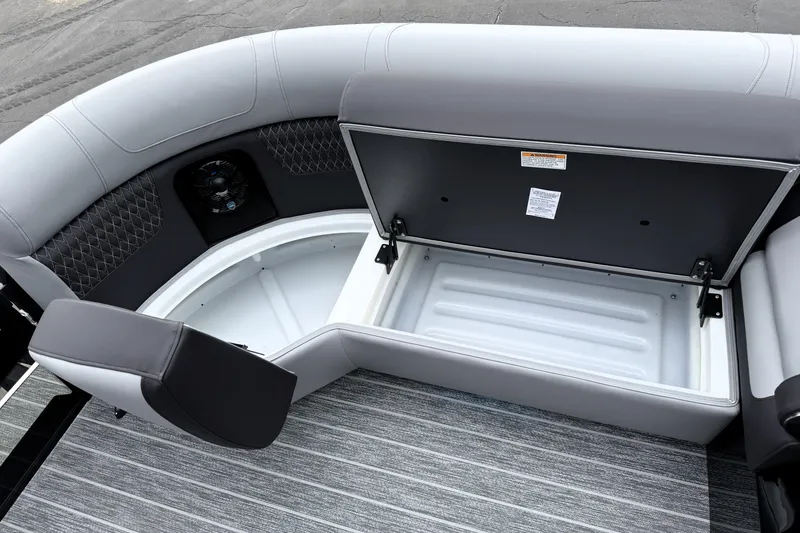 Slide: The Image of 2026 Premier 230 SOLARIS RS boat interior with open storage compartment and seating. - 36