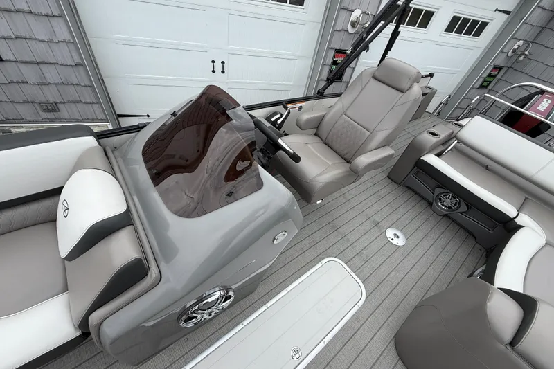 Slide: The Image of 2022 Avalon 2585 Catalina VRB boat interior with gray seating and modern dashboard. - 18