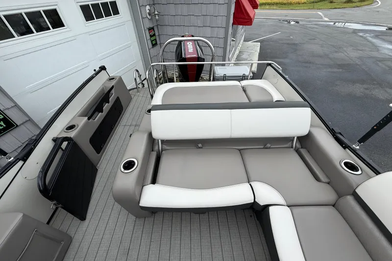 Slide: The Image of 2022 Avalon 2585 Catalina VRB boat interior with gray and white seating, cup holders, and railing. - 20