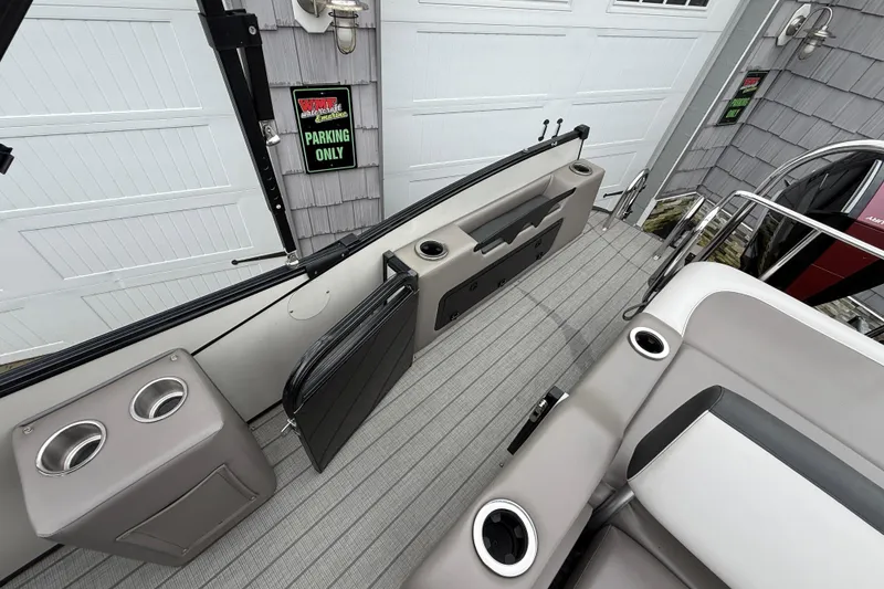 Slide: The Image of 2022 Avalon 2585 Catalina VRB boat interior with cup holders and seating. - 23