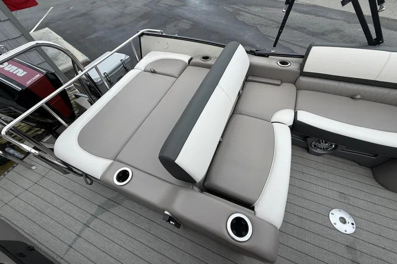 Slide: The Image of 2022 Avalon 2585 Catalina VRB boat interior with plush seating and cup holders. - 24