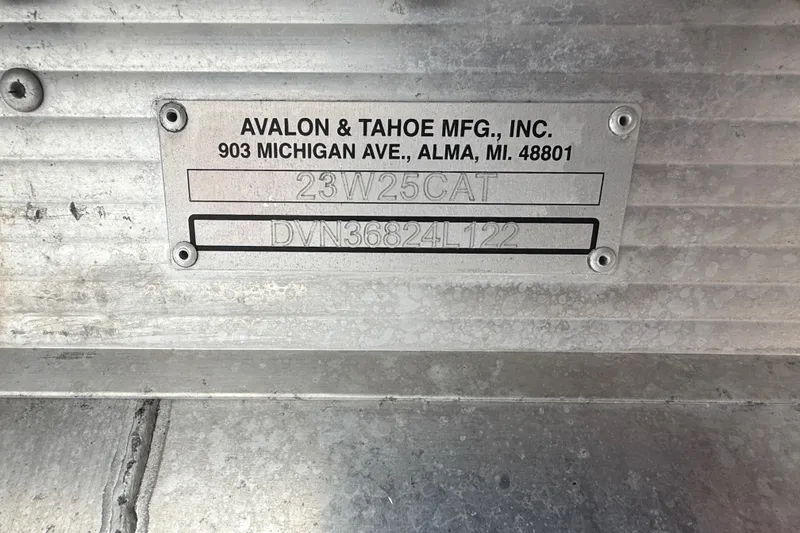 Slide: The Image of Metal identification plate for Avalon & Tahoe MFG, Inc., Alma, MI, on a 2022 Avalon boat. - 28