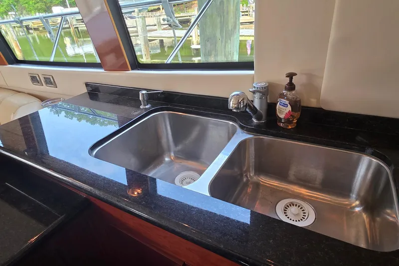 Slide: The Image of Luxury kitchen sink in 2006 Carver 56 Voyager yacht with granite countertop. - 20