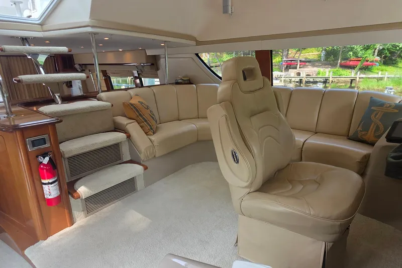 Slide: The Image of Luxurious interior of 2006 Carver 56 Voyager yacht with plush seating and elegant design. - 25