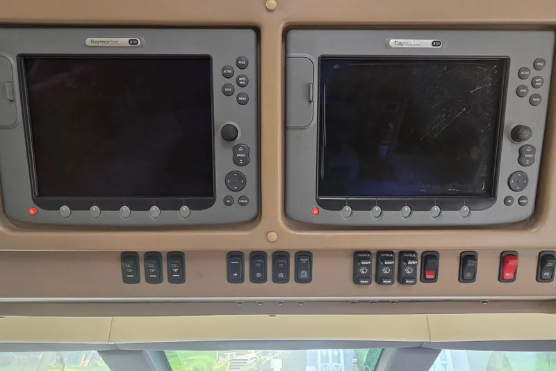 Slide: The Image of Control panel of a 2006 Carver 56 Voyager yacht with Raymarine displays. - 27