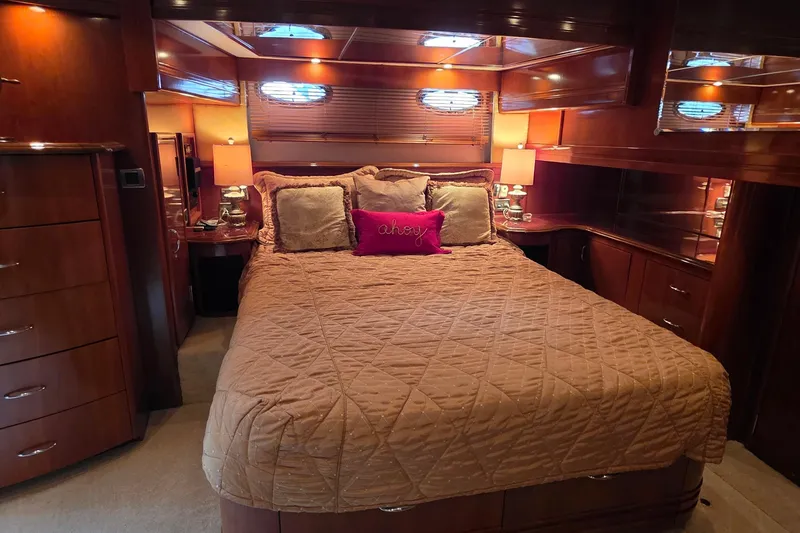 Slide: The Image of Luxurious bedroom interior of 2006 Carver 56 Voyager yacht with elegant wood finishes. - 44