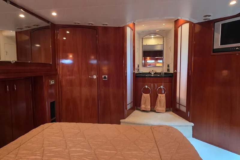 Slide: The Image of Luxurious interior of 2006 Carver 56 Voyager yacht with wood paneling and elegant furnishings. - 45