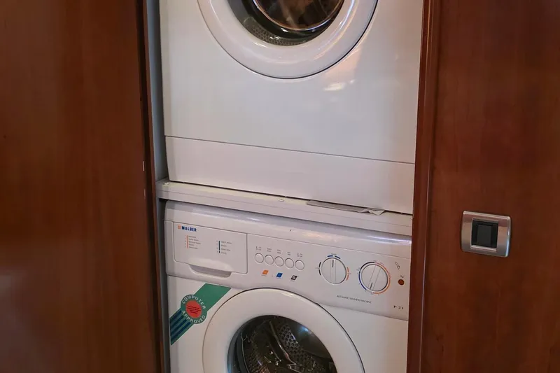 Slide: The Image of Stacked washer and dryer inside 2006 Carver 56 Voyager yacht. - 49