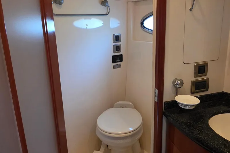 Slide: The Image of 2006 Carver 56 Voyager yacht bathroom with modern fixtures and compact design. - 52