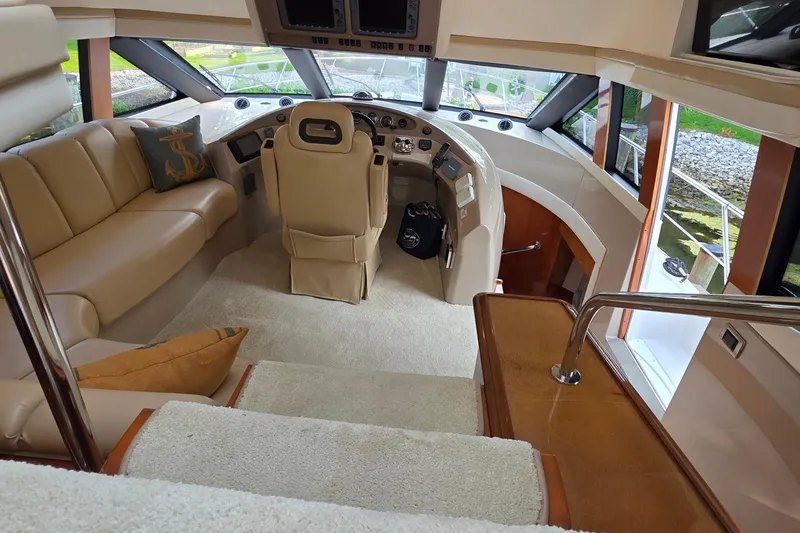 Slide: The Image of Luxurious interior of 2006 Carver 56 Voyager yacht with plush seating and helm. - 55